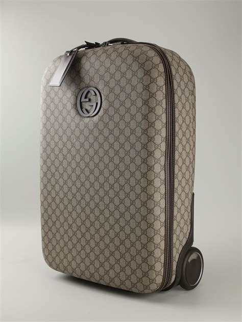 gucci luggage with wheels.